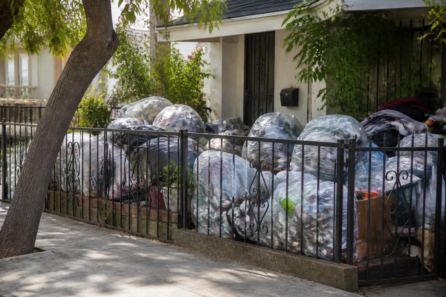 Trash piles return to Fairfax District yard amid criticism of city inaction
